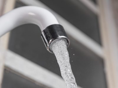 White kitchen sink faucet  - Close up